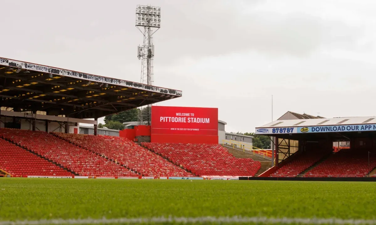 Pittodrie Stadium from pitch level: the main stand, the giant screen and the LED ribbon along the roof of the stand
